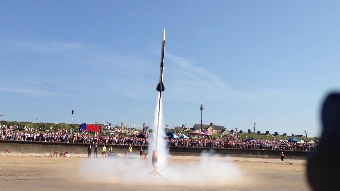 Triton II lifting off from the beach in front of the airshow crowd
